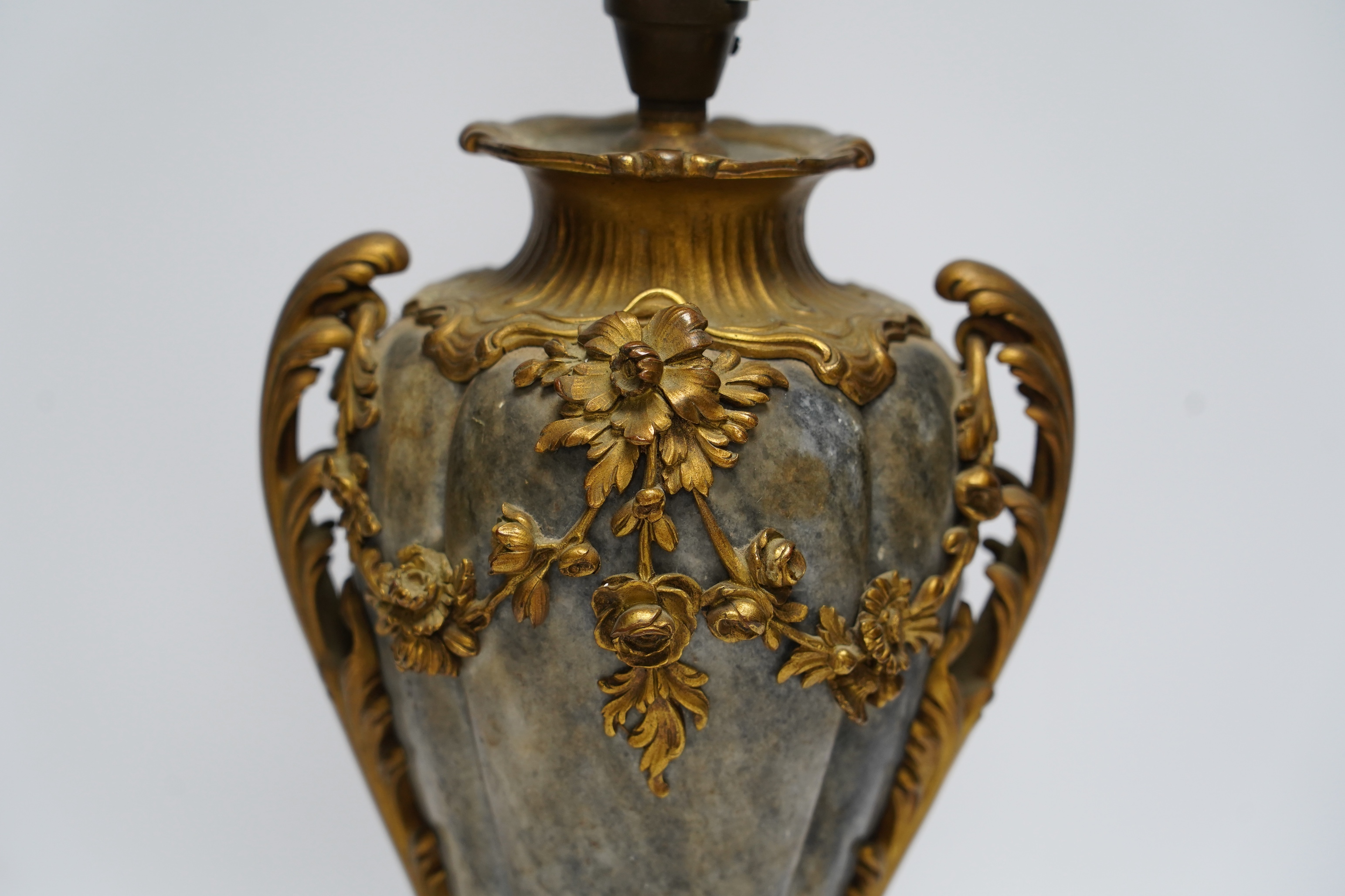 A 19th century French rococo style ormolu mounted grey marble lamp, converted to electricity, 29cm excluding light fittings